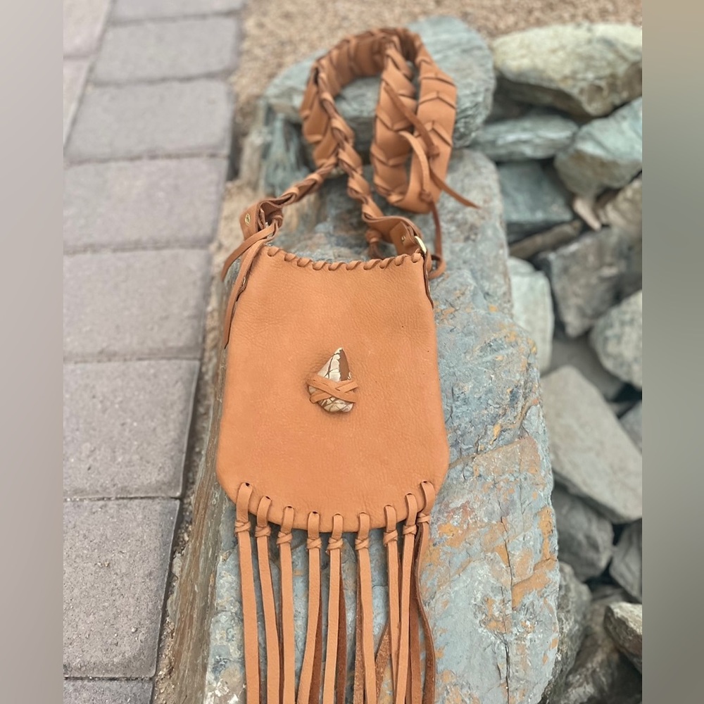 Handmade leather crossbody bag. Fringe detail and jasper stone detail.